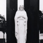 white marble Sacred Heart against black granite