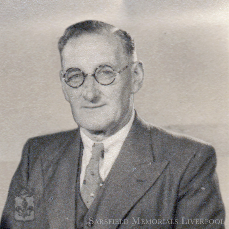 Black and white photo of a smart man from the 1950's