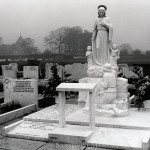 marble figure of a child hewn from a rock of white marble