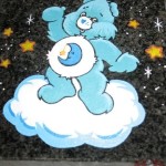 Headstone with blue care bear engraved