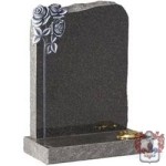 carved stone with shaped roses and vase grave stone