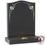 black feature grave stone with carving