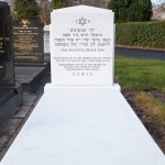 White Jewish headstone with marble slab