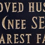 new lettering on a black granite memoria