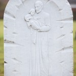 carved white st christopher head stone