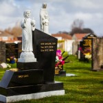 granite stepped gravestone and white marble boy child Jesus