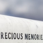 black lettering on a Carrara white marble memorial.