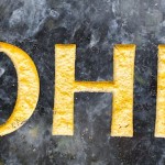 gold letters on grave stone
